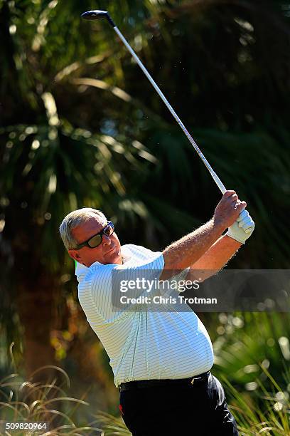 Fuzzy Zoeller hits a tee shot on the second hole during the first round of the 2016 Chubb Classic at the TwinEagles Club on February 12, 2016 in...