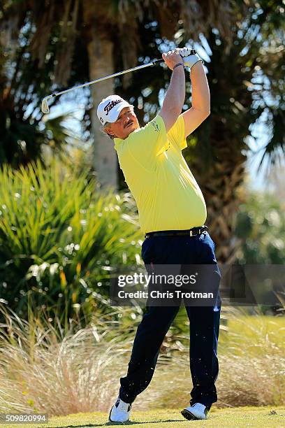 Jay Don Blake hits a tee shot on the second hole during the first round of the 2016 Chubb Classic at the TwinEagles Club on February 12, 2016 in...