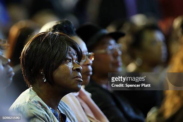 Voter listens to Democratic presidential candidate Hillary Clinton speak in South Carolina a day after her debate with rival candidate Bernie Sanders...