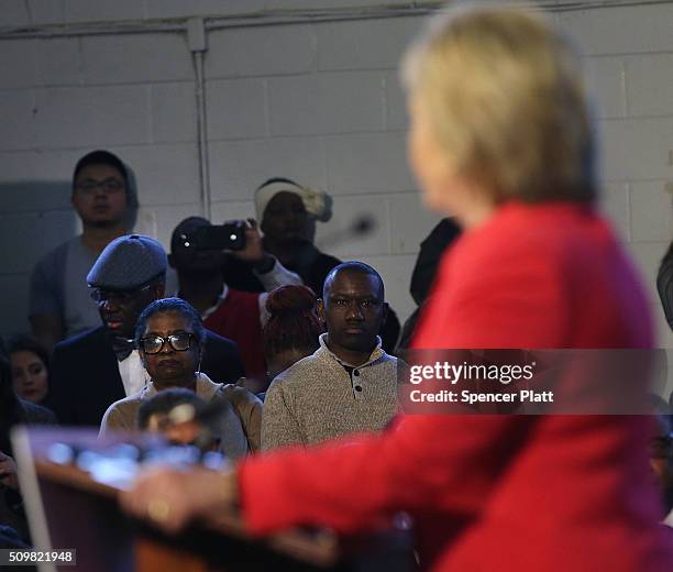 Voters listen as Democratic presidential candidate Hillary Clinton speaks in South Carolina a day after her debate with rival candidate Bernie...