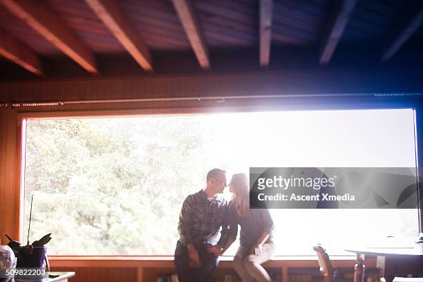 couple relax on home windowsill, living room - window sill stock pictures, royalty-free photos & images