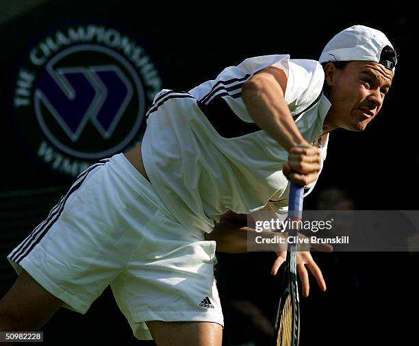 Guillermo Coria of Argentina serves during his first round match against Wesley Moodie of South Africa at the Wimbledon Lawn Tennis Championship on...