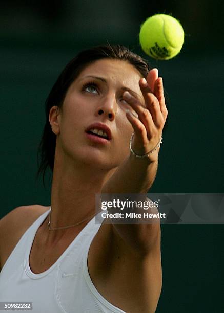 Anastasia Myskina of Russia in action during her first round match against Lubomira Kurhajcova of Slovakia at the Wimbledon Lawn Tennis Championship...