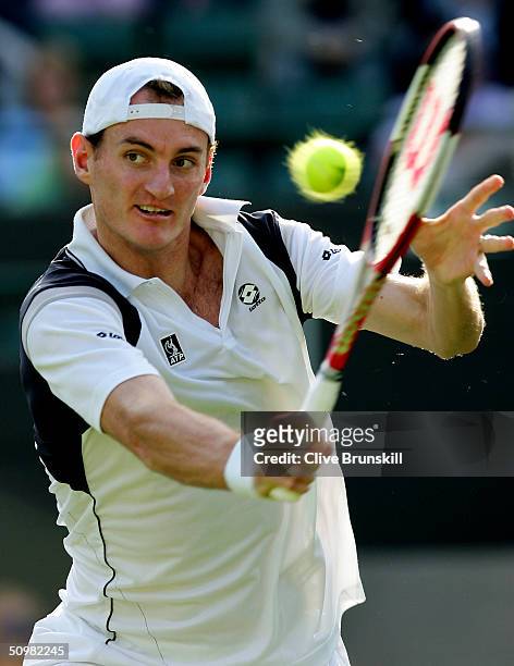 Wesley Moodie of South Africa in action during his first round match against Guillermo Coria of Argentina at the Wimbledon Lawn Tennis Championship...