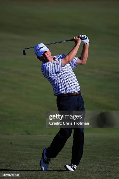 Jay Haas hits a second shot on the first hole during the first round of the 2016 Chubb Classic at the TwinEagles Club on February 12, 2016 in Naples,...