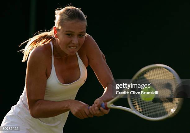 Maria Sharapova of Russia in action during her first round match against Yulia Beygelzimer of Ukraine at the Wimbledon Lawn Tennis Championship on...