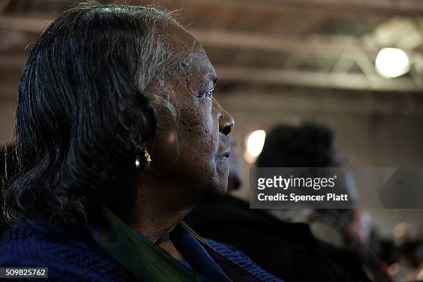 Voter listens to Democratic presidential candidate Hillary Clinton speak in South Carolina a day after her debate with rival candidate Bernie Sanders...