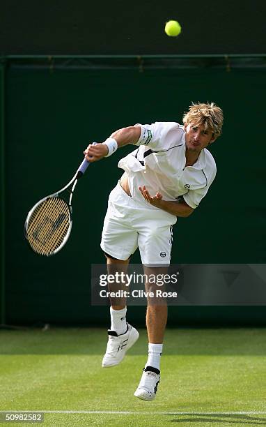 Juan Carlos Ferrero of Spain in action during his first round match against Julien Boutter of France at the Wimbledon Lawn Tennis Championship on...