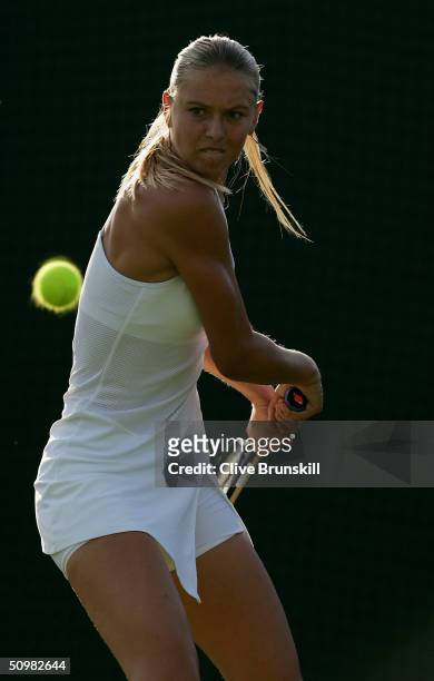 Maria Sharapova of Russia in action during her first round match against Yulia Beygelzimer of Ukraine at the Wimbledon Lawn Tennis Championship on...