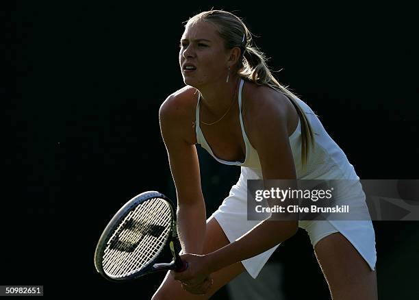 Maria Sharapova of Russia in action during her first round match against Yulia Beygelzimer of Ukraine at the Wimbledon Lawn Tennis Championship on...