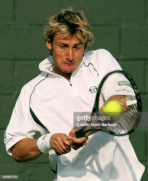 Juan Carlos Ferrero of Spain in action during his first round match against Julien Boutter of France at the Wimbledon Lawn Tennis Championship on...