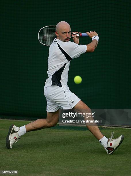 Jamie Delgado of USA in action during his first round match against Filippo Volandri of Italy at the Wimbledon Lawn Tennis Championship on June 21,...