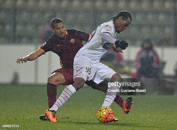 Jerry Mbakogu of Carpi FC is challenged by William Vainqueur of AS Roma during the Serie A match between Carpi FC and AS Roma at Alberto Braglia...