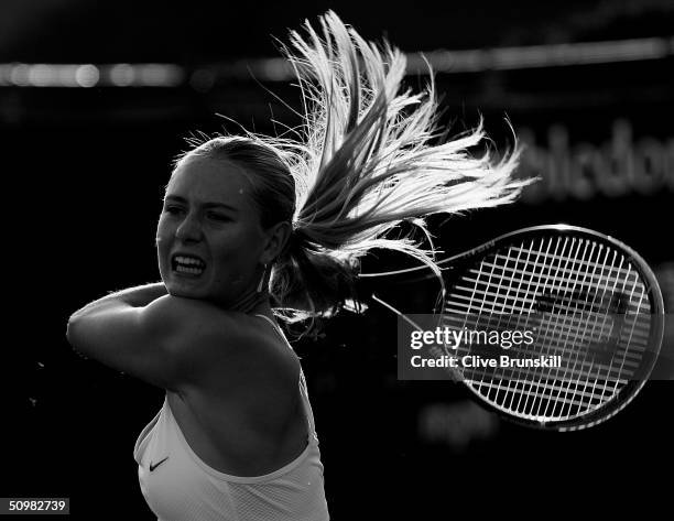 Maria Sharapova of Russia in action during her first round match against Yulia Beygelzimer of Ukraine at the Wimbledon Lawn Tennis Championship on...