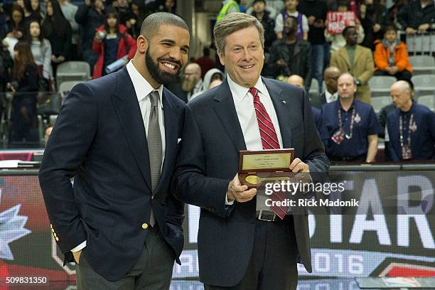 Rap star Drake accepts the key to the City from Toronto Mayor John Tory prior to the celebrity game. NBA all star Celebrity game at Ricoh Coliseum,...