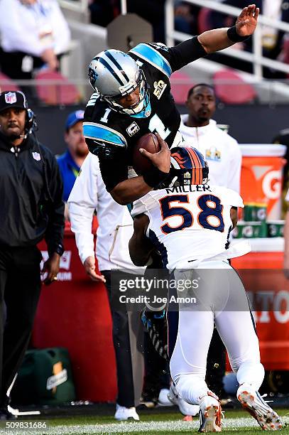 Carolina Panthers quarterback Cam Newton is tackled by Denver Broncos linebacker Von Miller as he goes airborne in Super Bowl 50 at Levi's Stadium in...