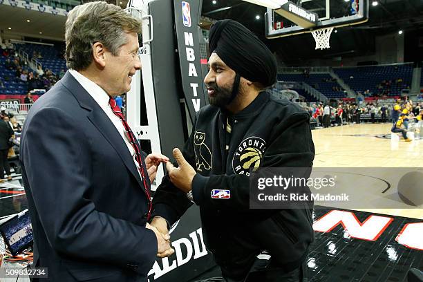 Mayor John Tory says hello to Raptor season ticket holder Nav Bhatia before the game start. NBA all star Celebrity game at Ricoh Coliseum, all part...