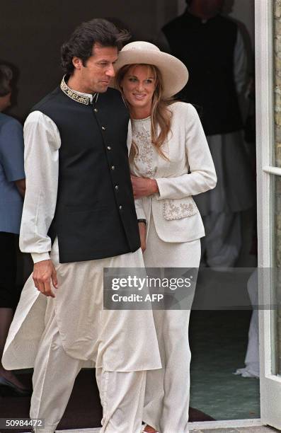 In this picture taken 20 June 1995, Pakistan cricketer and politician Imran Khan and Jemima Goldsmith leave Richmond Registry Office in London after...