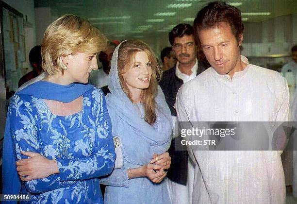 In this picture taken 23 May 1997, The late Princess of Wales is given a tour of Imran Khan's charity cancer hospital with Khan and his wife Jemima...