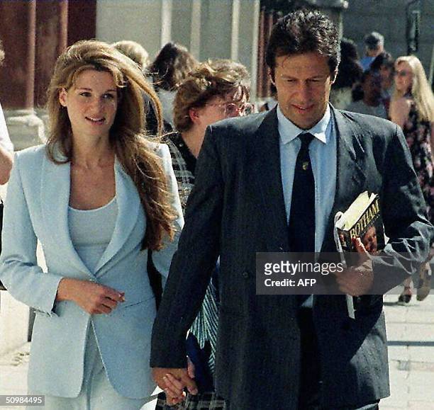 In this picture taken 18 July 1996, Former Pakistan cricket captain Imran Khan is accompanied by his wife Jemima as he arrives at the High Court in...