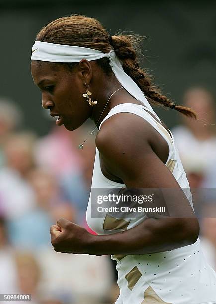 Serena Williams of USA celebrates winning her first round match against Jie Zheng of China at the Wimbledon Lawn Tennis Championship on June 22, 2004...