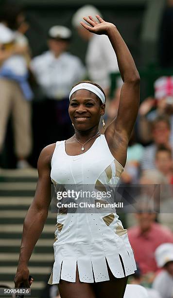 Serena Williams of USA celebrates winning her first round match against Jie Zheng of China at the Wimbledon Lawn Tennis Championship on June 22, 2004...