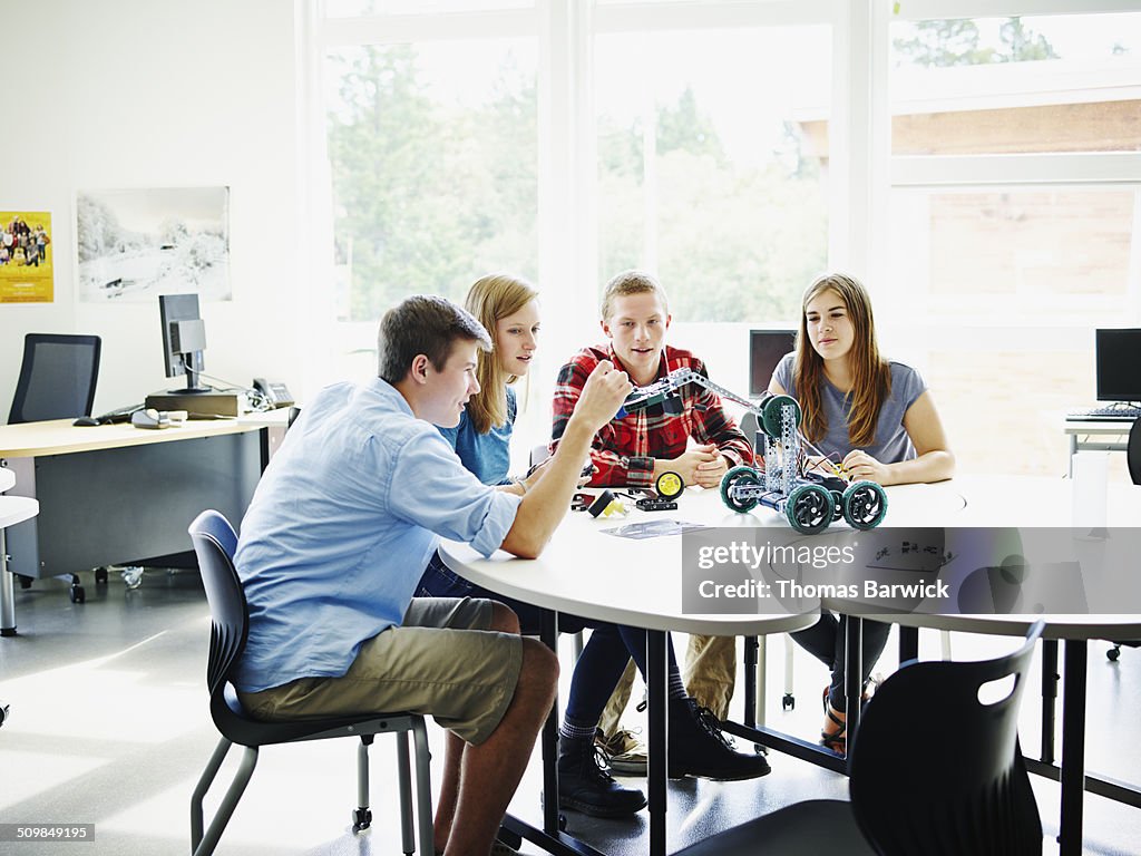 Robotics Student Table Group Of Students At Table Building Robot Together High-Res Stock Photo ...