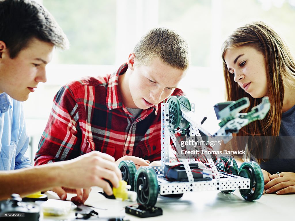 Student Building Rorbot Students In Classroom Building Robot Together High-Res Stock Photo ...