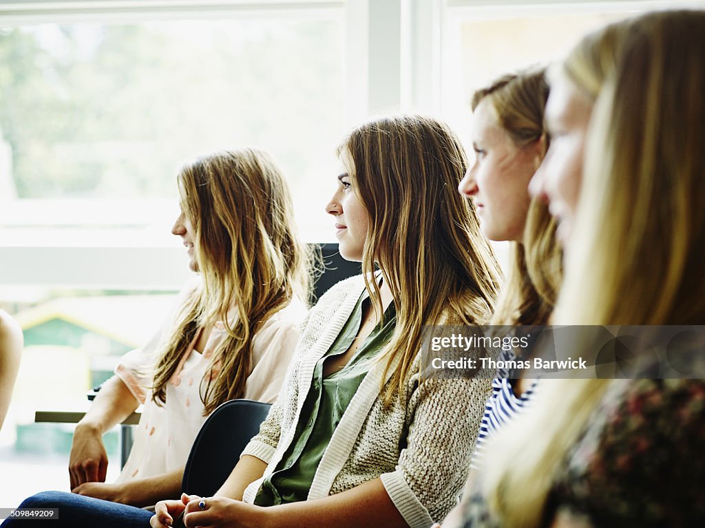 Female students sitting in high school classroom
