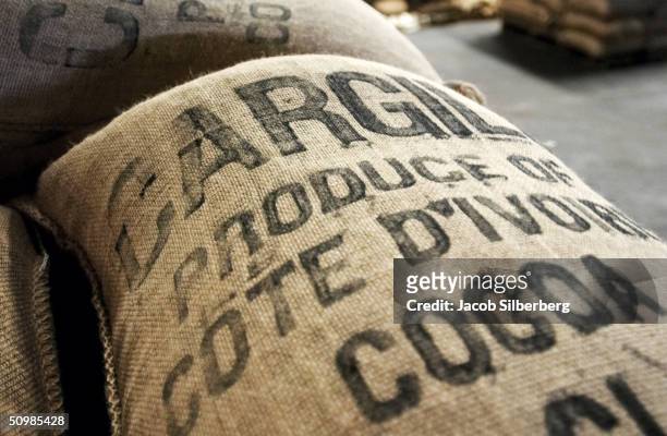Bag of cocoa marked "Cargill" for the American cocoa firm, waits at a warehouse at the port in Abidjan, Ivory Coast, May 4, 2004. The facility is...