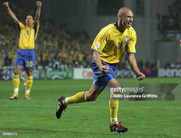 Henrik Larsson of Sweden celebrates after scoring the equalising goal with a penalty during the UEFA Euro 2004, Group C match between Denmark and...