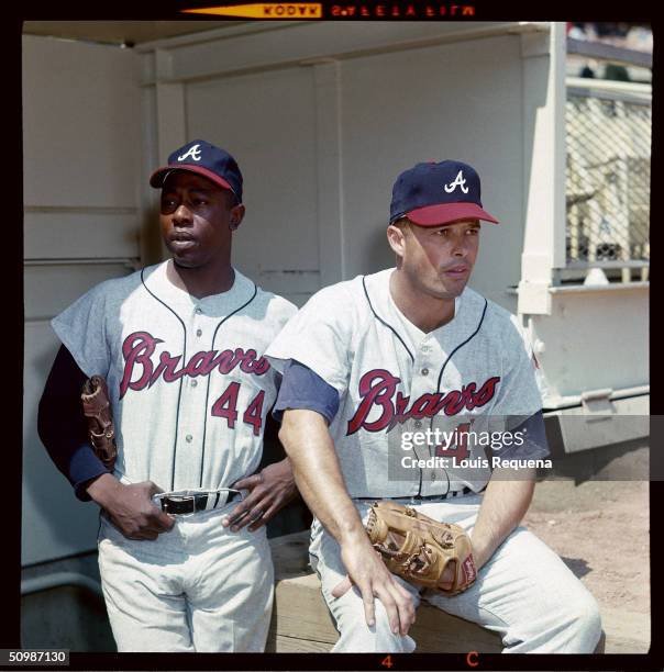 Hank Aaron and Eddie Mathews of the Atlanta Braves look on from the dugout circa 1966. Hank Aaron played for the Atlanta Braves from 1954 to 1954 and...