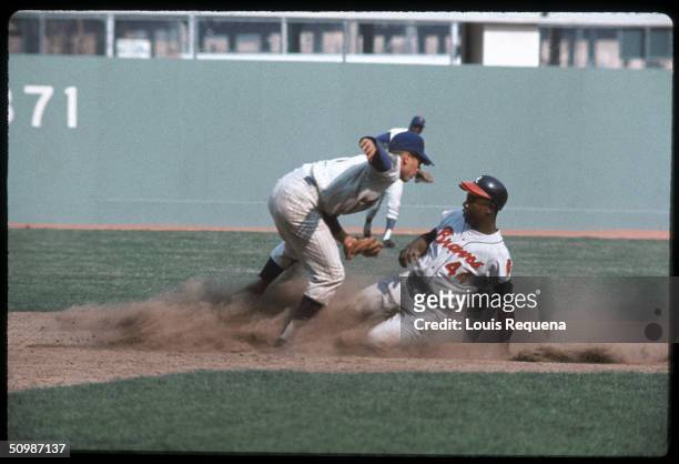 Hank Aaron of the Atlanta Braves slides into second base during a game against the New York Mets circa 1969 at Shea Stadium in Flushing, New York....