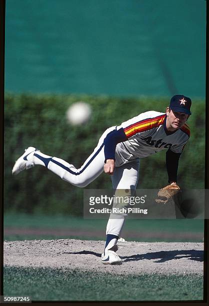 Nolan Ryan of the Houston Astros delivers a pitch during a game against the Chicago Cubs circa 1988 at Wrigley Field in Chicago, Illinois. Nolan Ryan...
