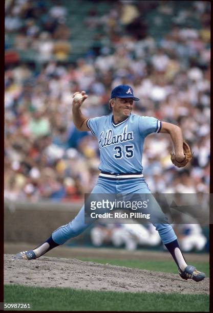 Phil Niekro of the Atlanta Braves pitches during a game against the Chicago Cubs circa 1982 at Wrigley Field in Chicago Illinois.