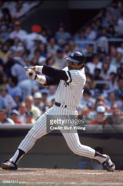 Reggie Jackson of the New York Yankees takes a swing during a game at Yankee Stadium in Bronx, New York. Jackson played for the New York Yankees from...