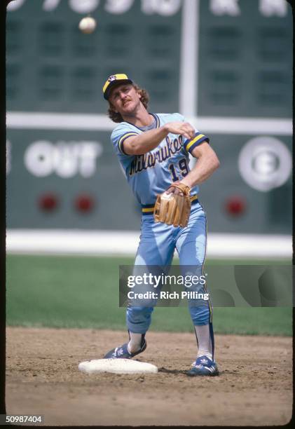 Robin Yount of the Milwaukee Brewers steps on second base as he trows to first during a game against the Boston Red Sox in 1983 at Fenway Park in...