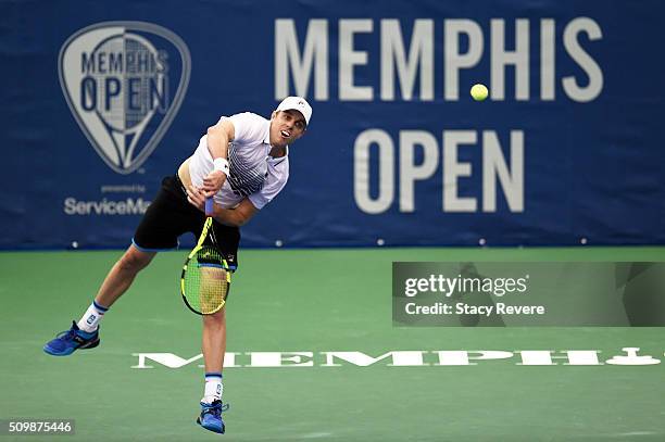 Sam Querrey of the United States serves to Yoshihito Nishioka of Japan during their quarterfinal singles match on Day 5 of the Memphis Open at the...