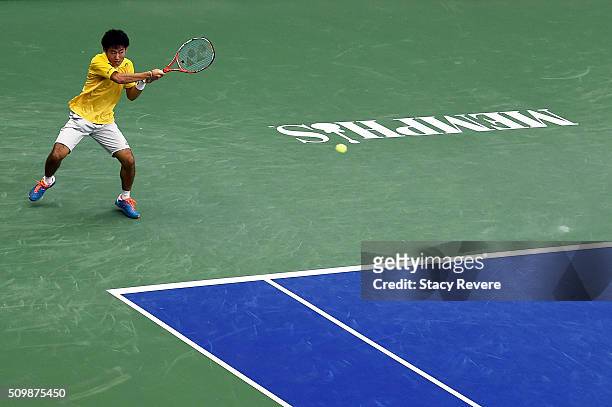 Yoshihito Nishioka of Japan returns a shot to Sam Querrey of the United States during their quarterfinal singles match on Day 5 of the Memphis Open...
