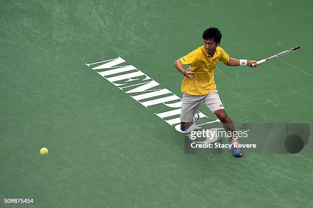 Yoshihito Nishioka of Japan returns a shot to Sam Querrey of the United States during their quarterfinal singles match on Day 5 of the Memphis Open...