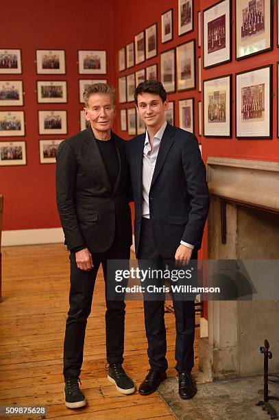 Student poses with Calvin Klein before his address to the Cambridge Union at The Cambridge Union on February 12, 2016 in Cambridge, Cambridgeshire.