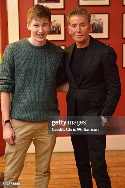 President of the Cambridge Union Society posing with Calvin Klein after his address to the Cambridge Union at The Cambridge Union on February 12,...