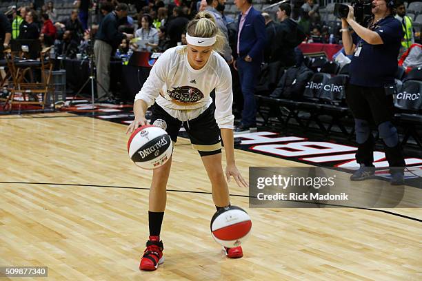 Tennis star Eugenie Bouchard uses two balls to practice her dribble prior to the game. NBA all star Celebrity game is 1st half action at Ricoh...