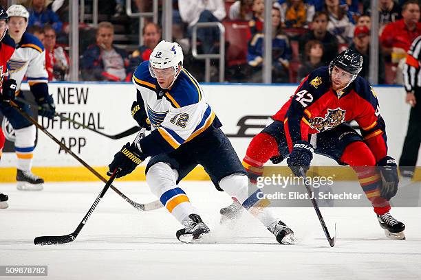 Jori Lehters of the St. Louis Blues skates with the puck against Quinton Howden of the Florida Panthers at the BB&T Center on February 12, 2016 in...