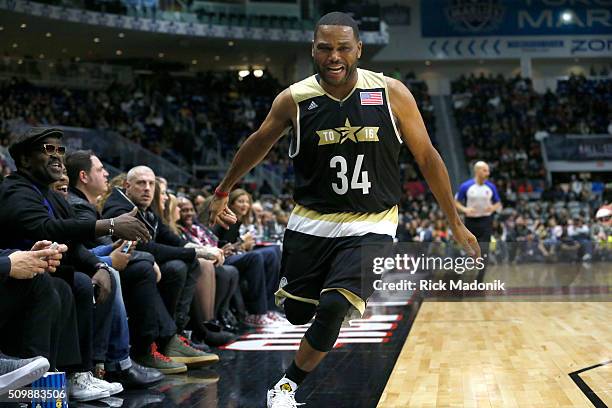 Actor Anthony Andersen hi fives the front row following a basket. NBA all star Celebrity game is 2nd half action at Ricoh Coliseum, all part of the...