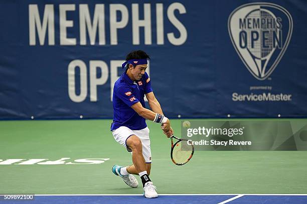 Kei Nishikori of Japan returns a shot to Mikhail Kukushkin of Kazakhstan during their quarterfinal singles match on Day 5 of the Memphis Open at the...