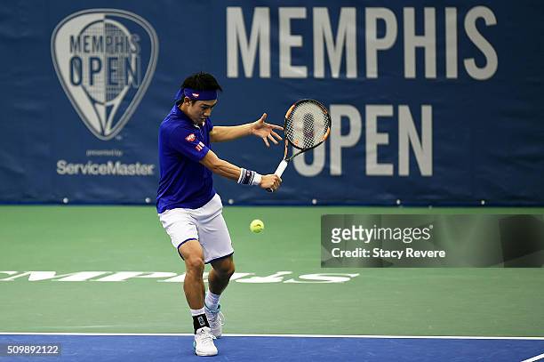 Kei Nishikori of Japan returns a shot to Mikhail Kukushkin of Kazakhstan during their quarterfinal singles match on Day 5 of the Memphis Open at the...