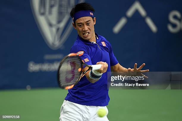 Kei Nishikori of Japan returns a shot to Mikhail Kukushkin of Kazakhstan during their quarterfinal singles match on Day 5 of the Memphis Open at the...