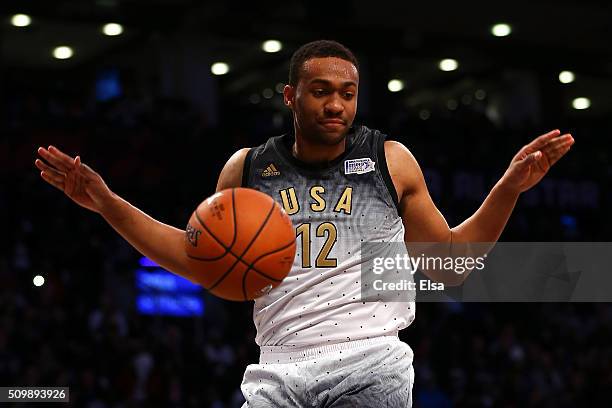 Jabari Parker of the Milwaukee Bucks and the United States team dunks in the second half against the World team during the BBVA Compass Rising Stars...