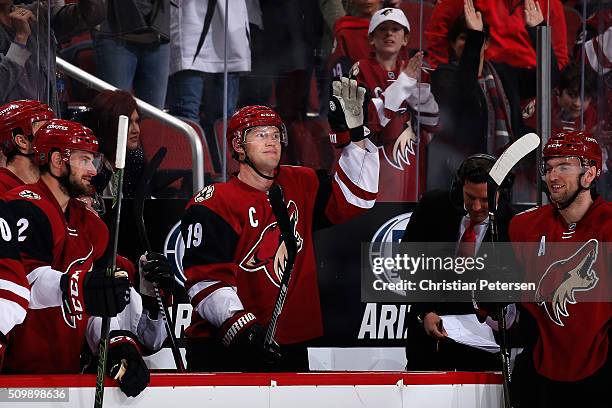 Shane Doan of the Arizona Coyotes waves to the fans after the annoucenment of his franchise leading 930th point registered during the second period...